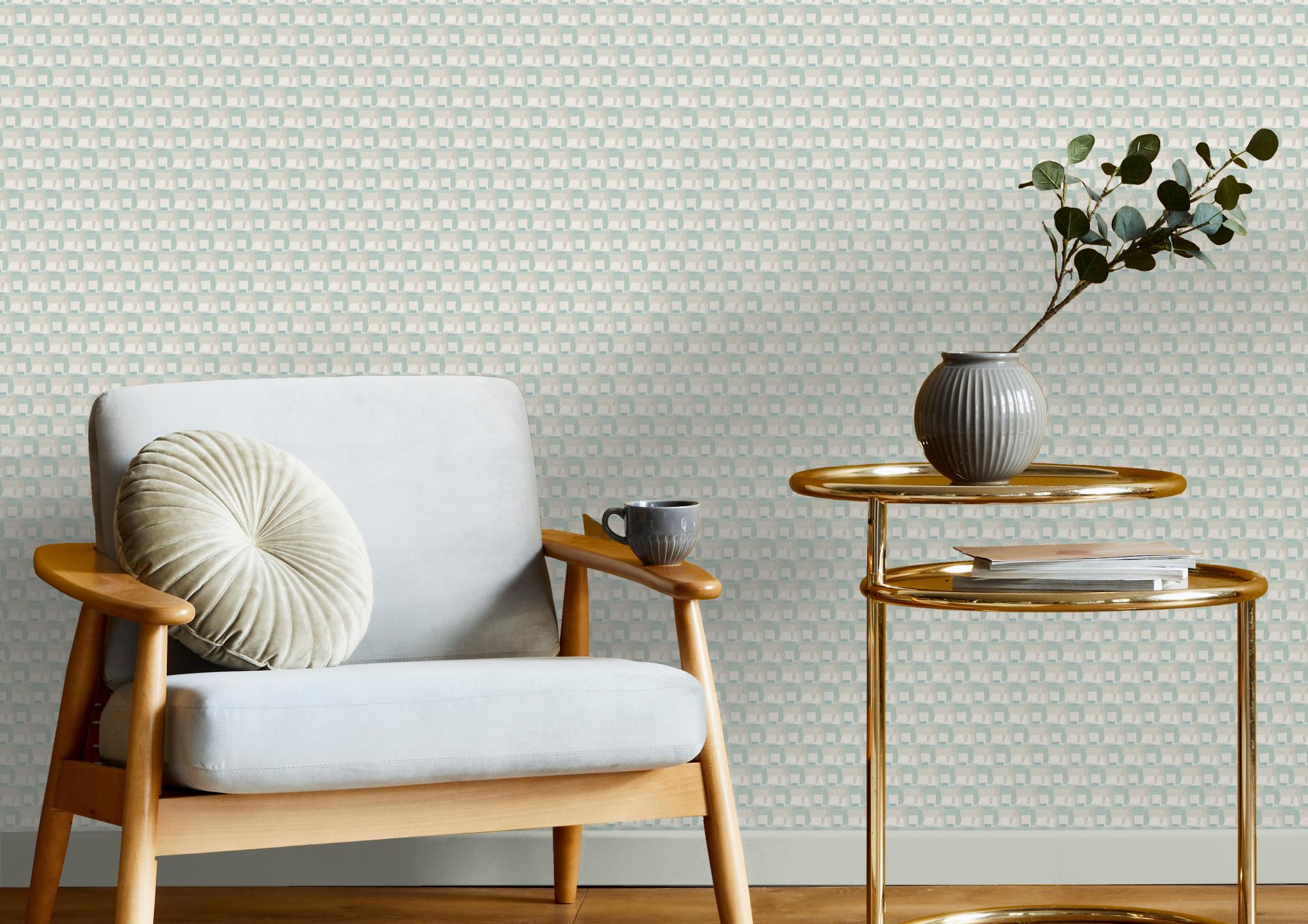 Stylish interior featuring Jan Erika's Ernö Collection wallpaper, a cozy chair, and decorative elements inspired by Trellick Tower.