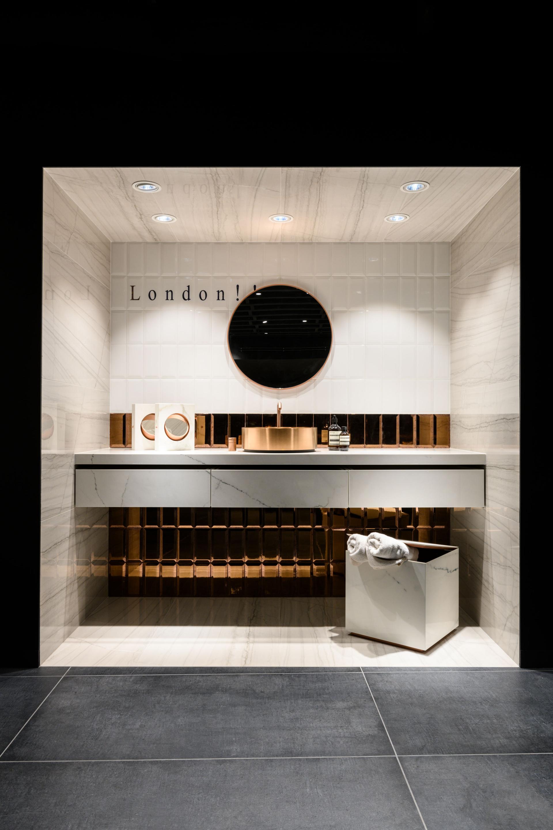 Stylish bathroom display in Iris Ceramica Group's UK showroom, featuring modern fixtures and elegant tiling.