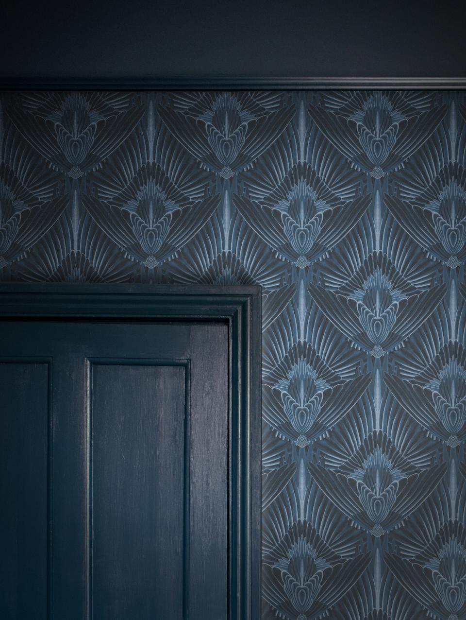 Glamorous wallpaper from Divine Savages featuring intricate blue patterns, enhancing a stylish interior design aesthetic.