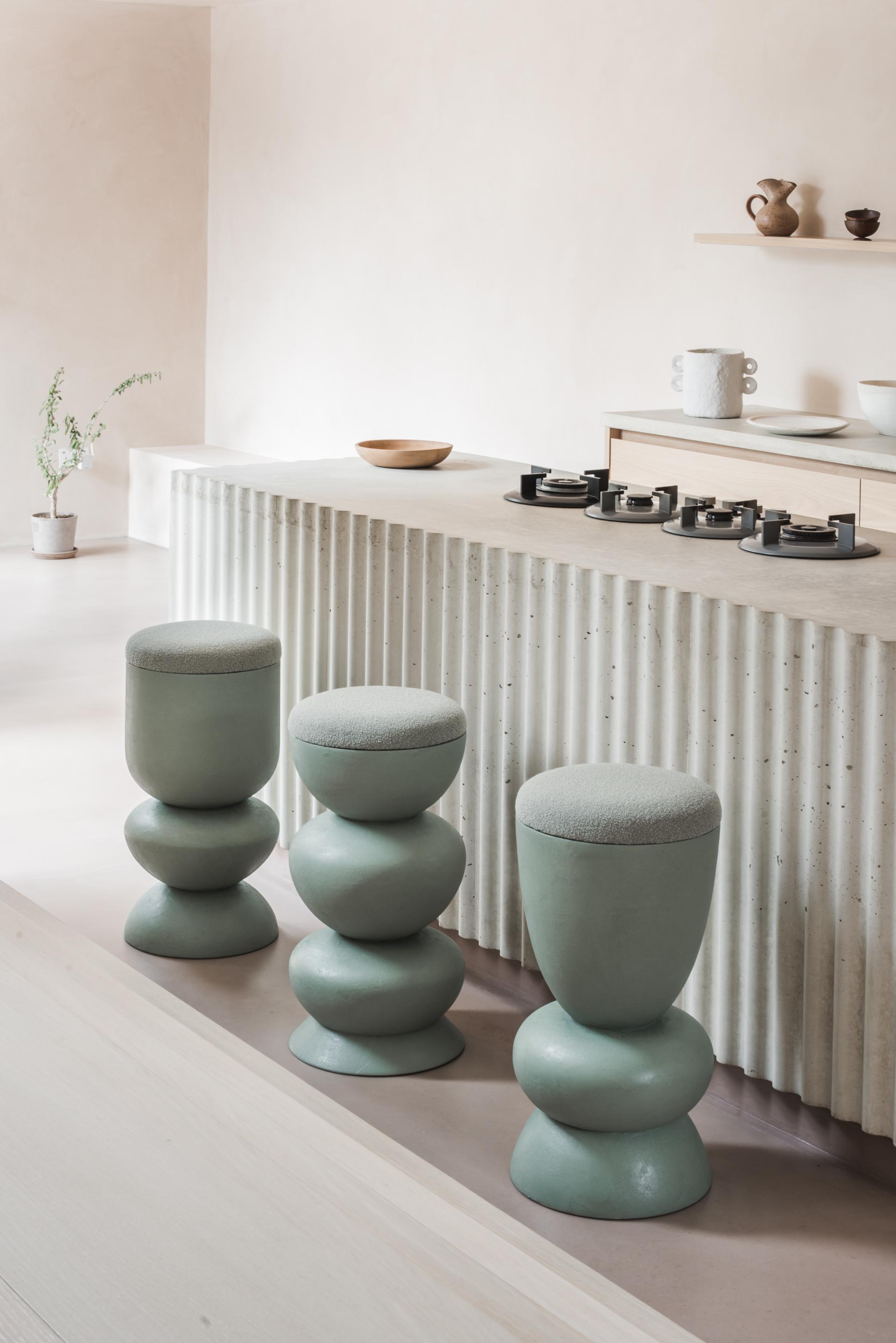 Curvaceous stools from Sella Concept's debut furniture collection, inspired by Hampstead Ladies’ Pond, displayed in a modern interior.