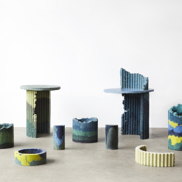 Colorful, textured furniture pieces made from recycled materials, showcasing innovative design at the London Design Fair.