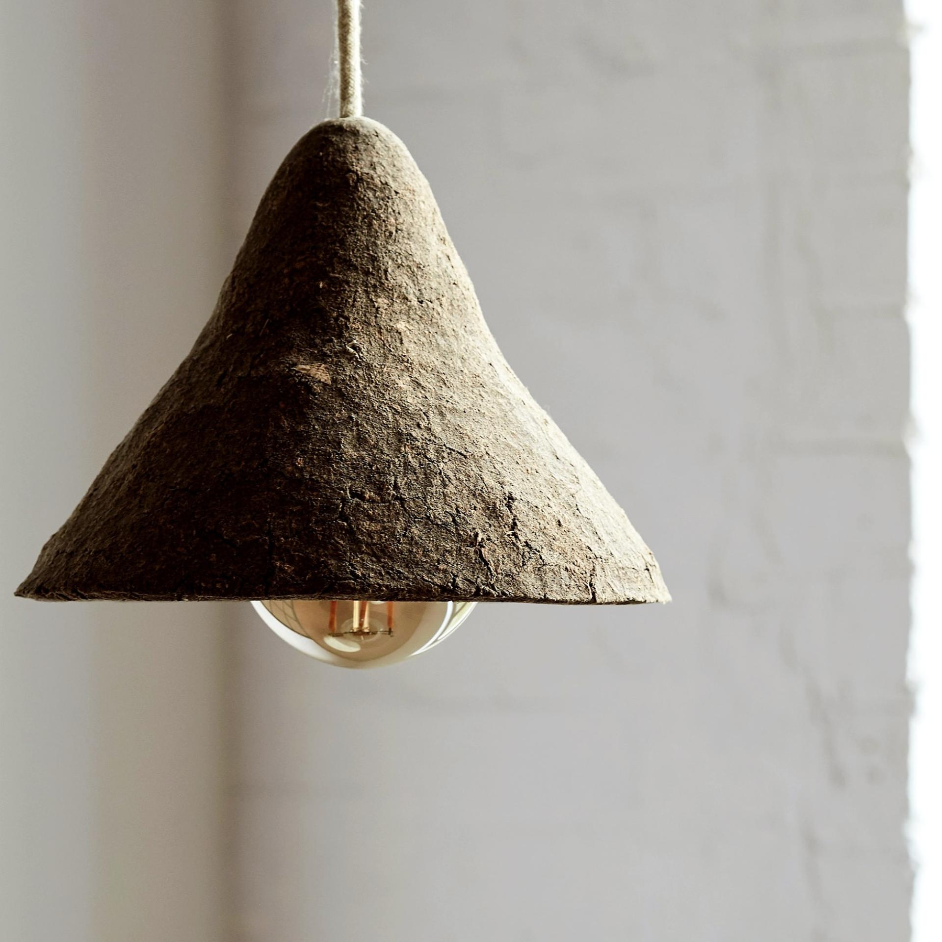 Handcrafted pendant lamp made from sustainable biomaterials, showcasing innovative design and eco-friendly craftsmanship.
