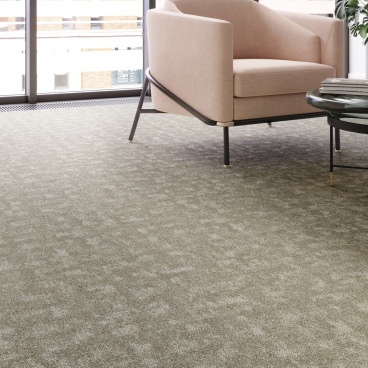 Modern interior featuring Forbo's Tessera Union collection flooring, a soft textured surface with stylish furniture arrangement.