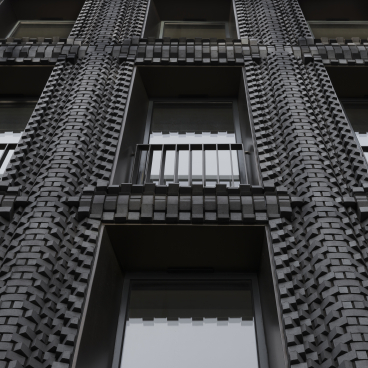 Innovative brick facade design of a modern building showcasing textured black bricks and large windows, reflecting contemporary architecture.