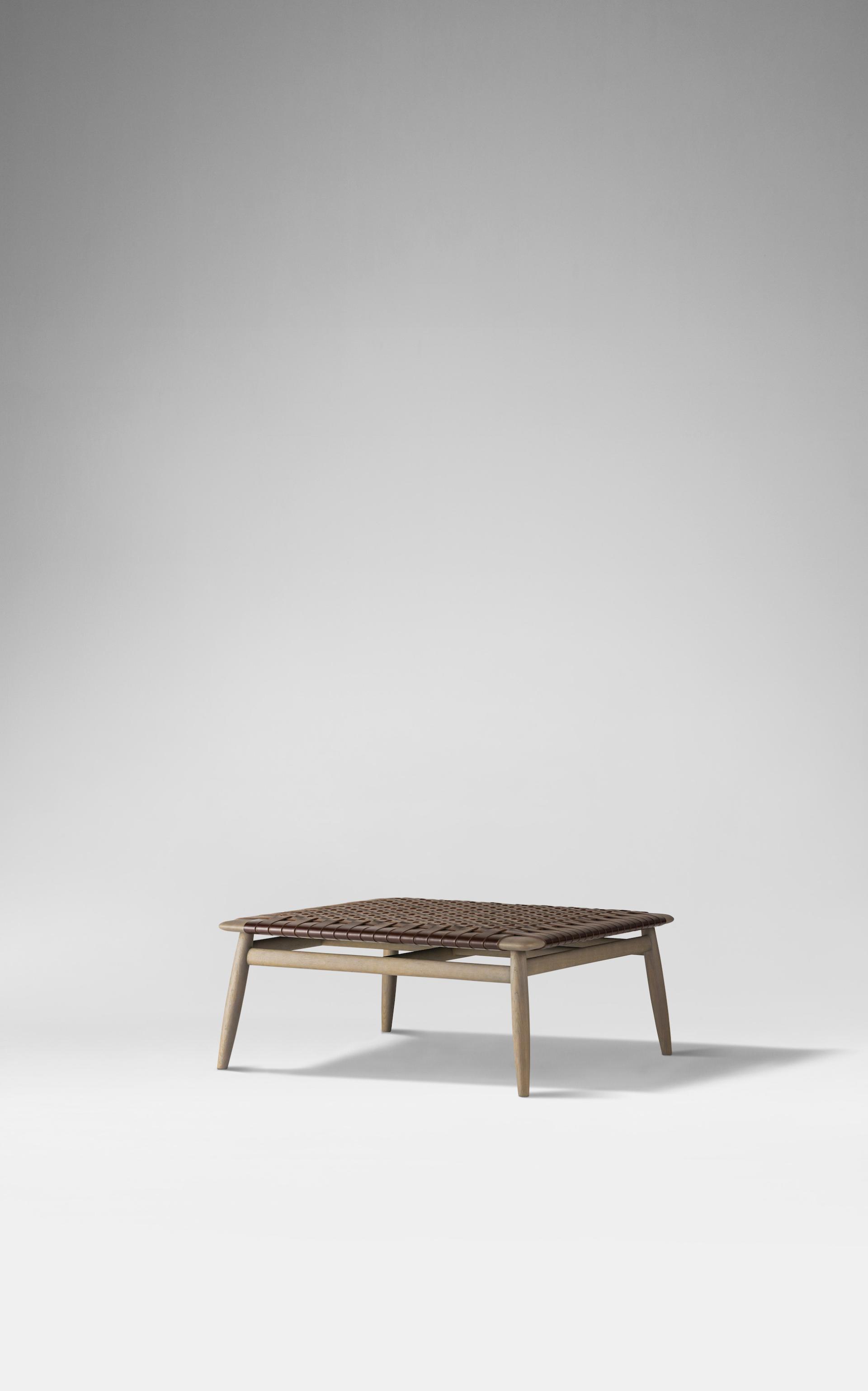 Minimalist coffee table with woven surface, embodying Japanese design and craftsmanship in Ritzwell's latest collection.