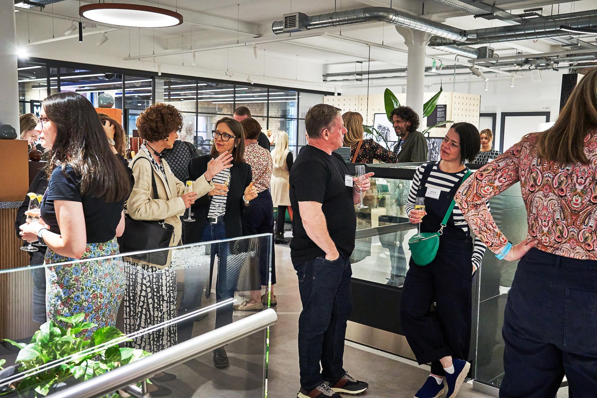 Networking event featuring attendees engaging in conversation, celebrating the launch of the podcast 42 Roles in the Built Environment.