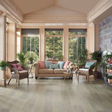 Stylish living room showcasing Karndean Designflooring's Art Select wood collection with modern furniture and natural light.