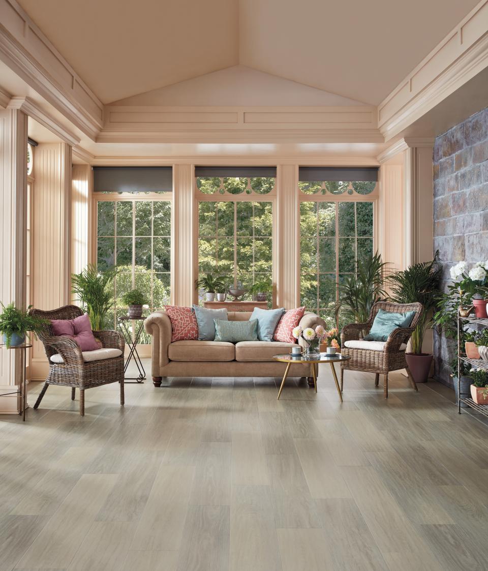 Stylish living room showcasing Karndean Designflooring's Art Select wood collection with modern furniture and natural light.