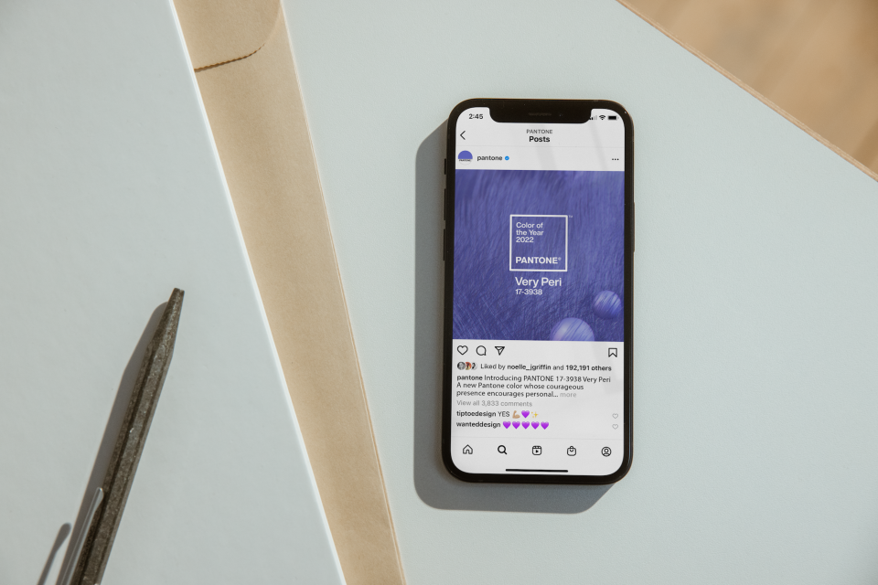 Pantone's announcement of Very Peri, the Colour of the Year 2022, displayed on a smartphone screen.