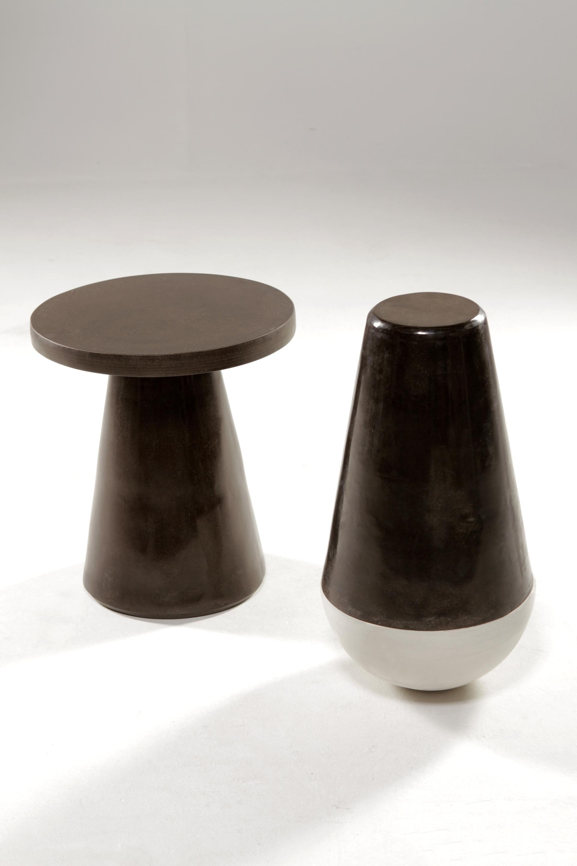 Stylish, lightweight furniture pieces resembling granite stone, showcasing sustainable and biodegradable design by That’s Caffeine.