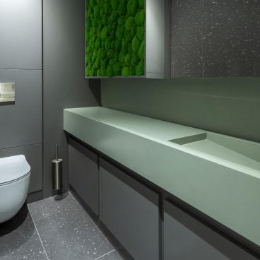 Modern eco-friendly restroom featuring a sleek design, natural elements, and sustainable materials for a healthy workplace environment.