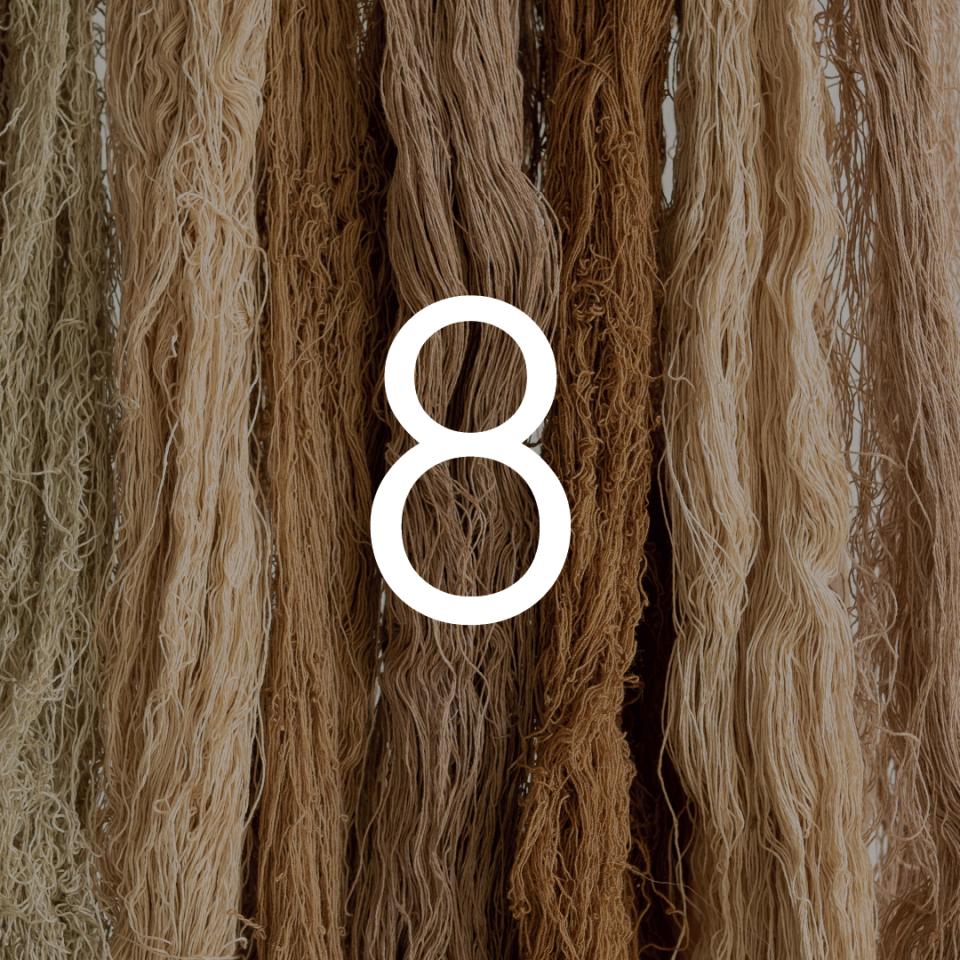 Natural fibers in various shades hang together, representing Zeefier's innovative textile research in sustainable materials.