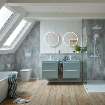 Stylish bathroom featuring VADO's Cameo collection with modern dual sinks, a freestanding tub, and a sleek shower.