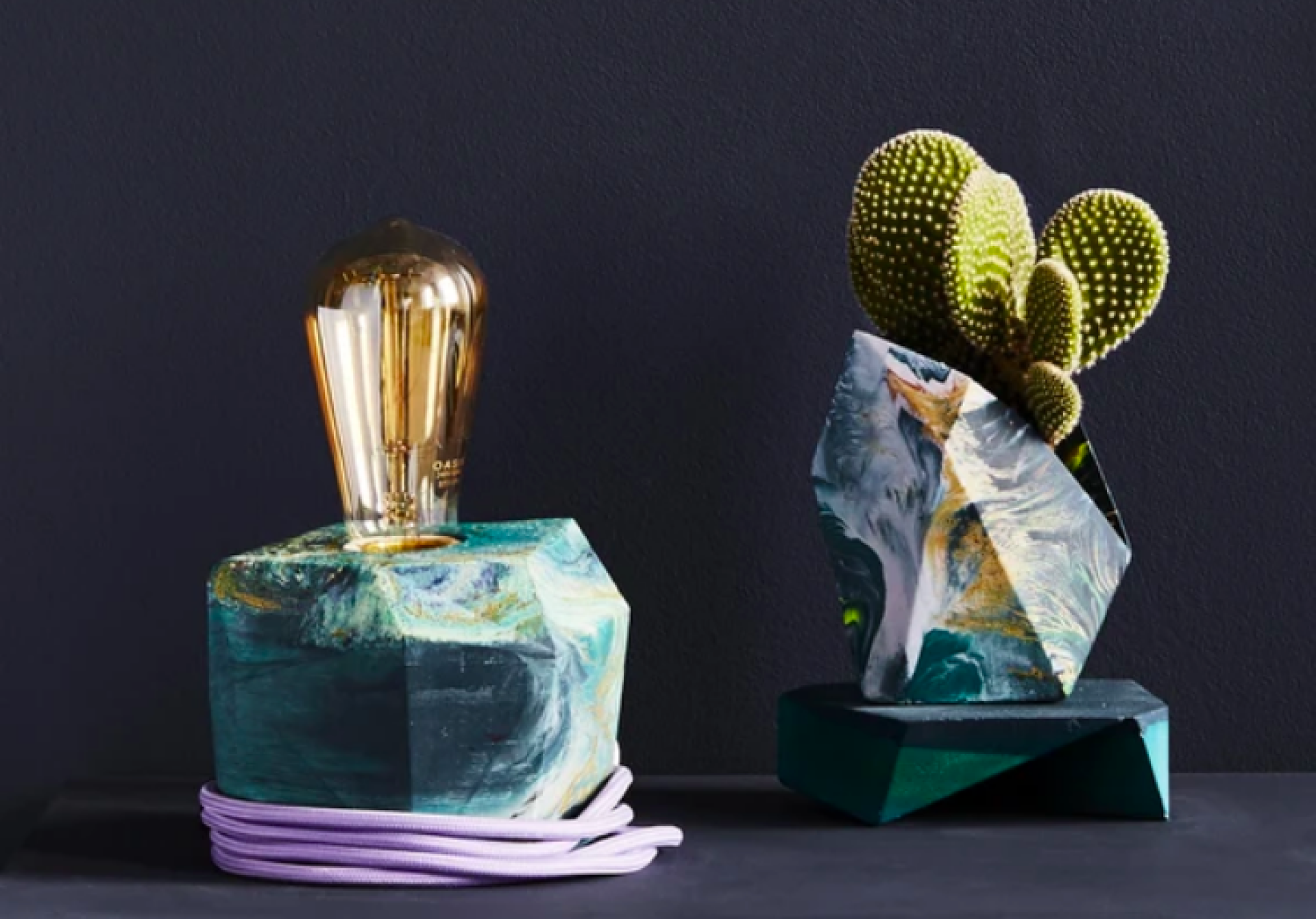 Colorful modern lamp and abstract planter with cactus, showcasing Manchester's contemporary craft design scene.