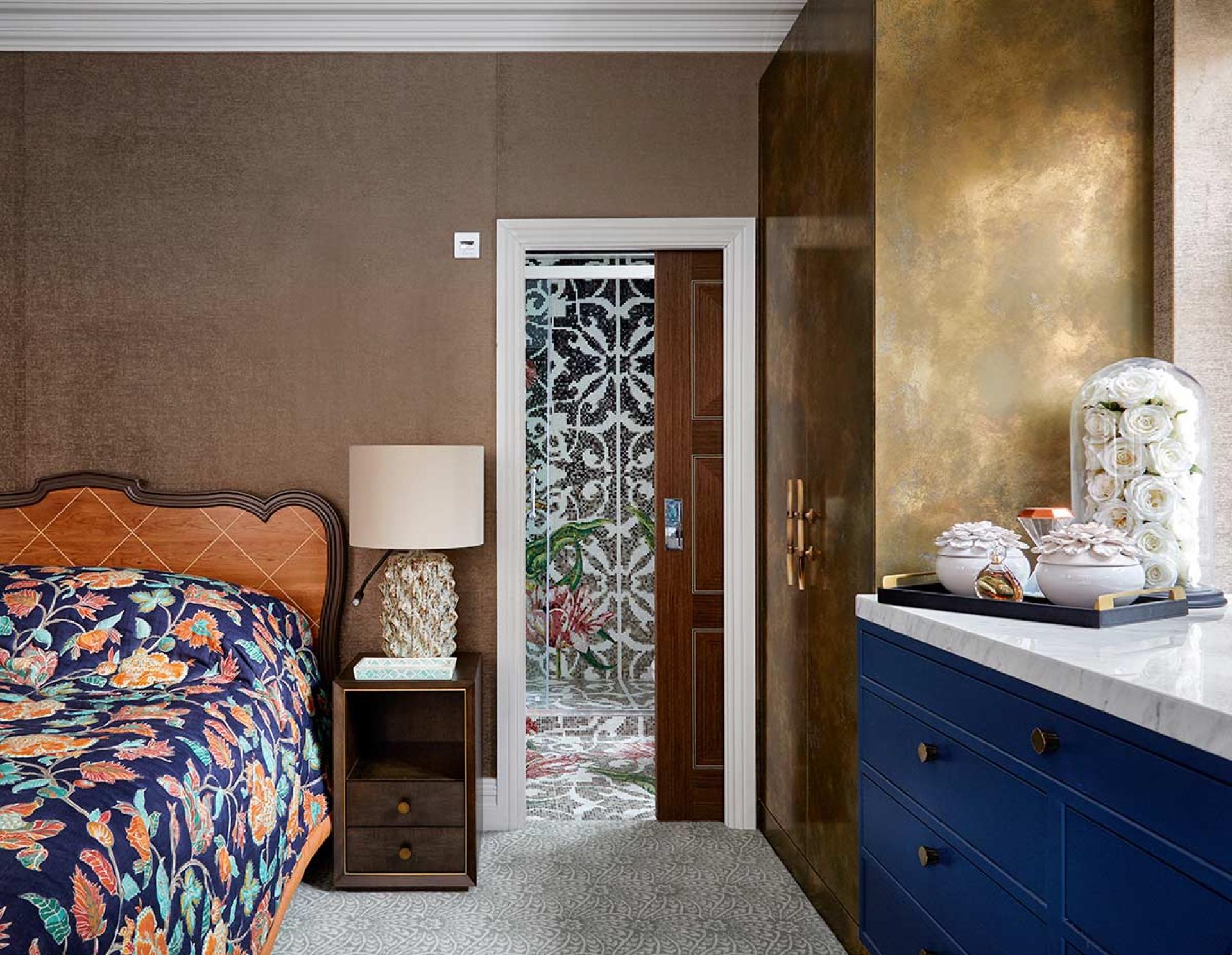 Elegant bedroom design featuring a floral-patterned quilt, stylish furniture, and decorative elements inspired by Van Gogh's artistry.