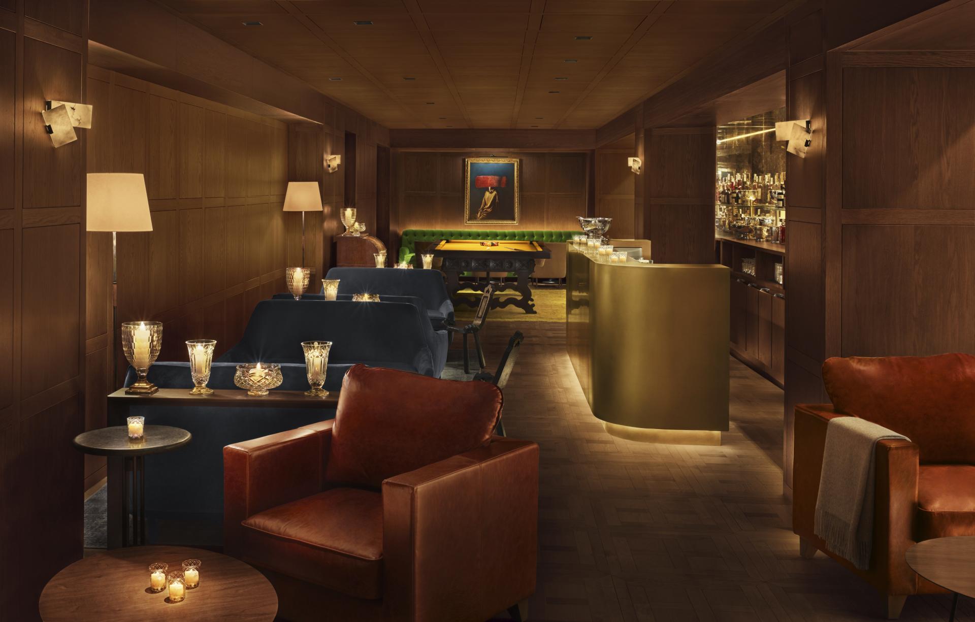 Luxurious lounge area in the Barcelona EDITION, featuring elegant seating and a stylish bar, designed for exclusivity.