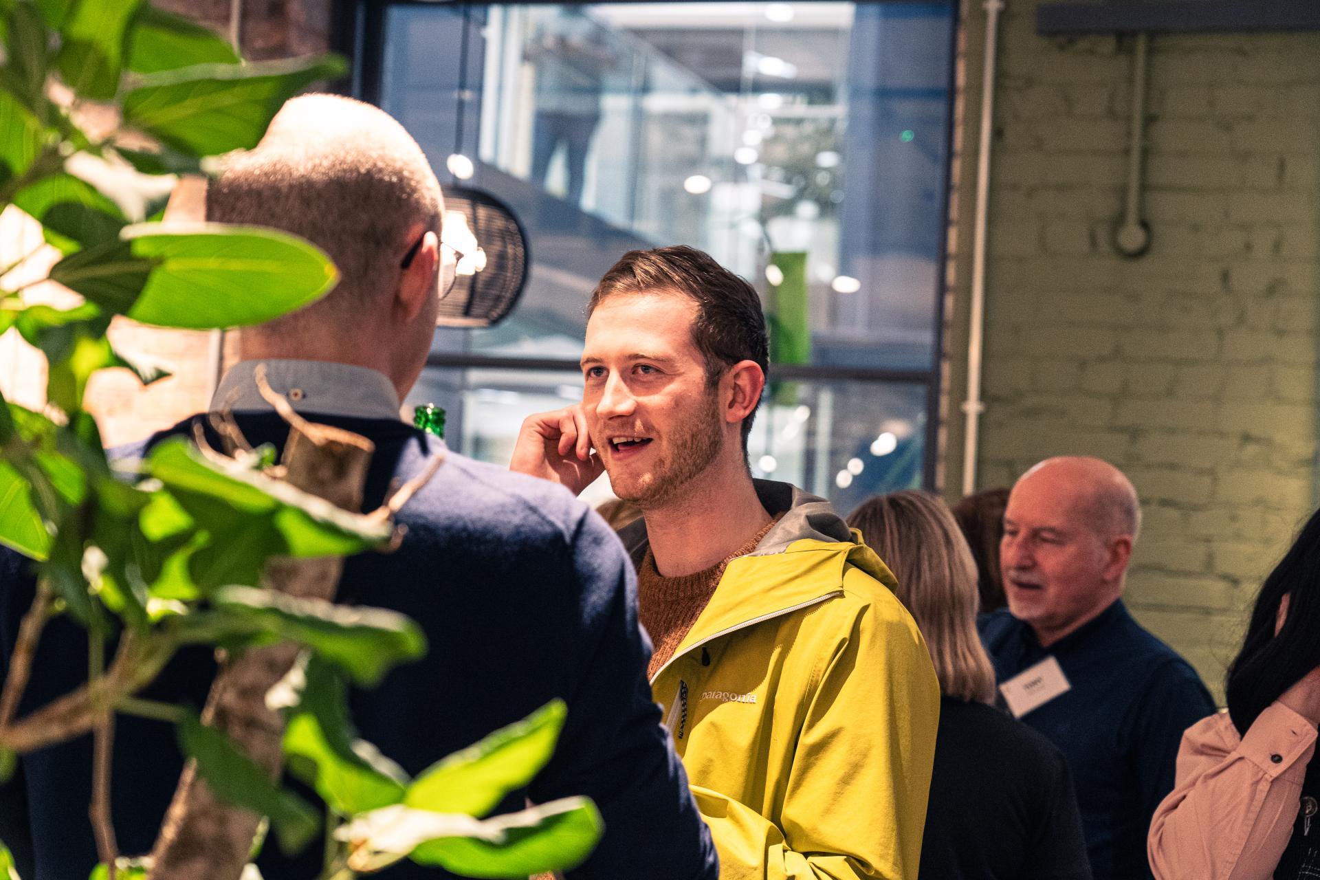 Attendees engaging in conversation at Material Source Studio's event on designing for equity, diversity, and inclusion.
