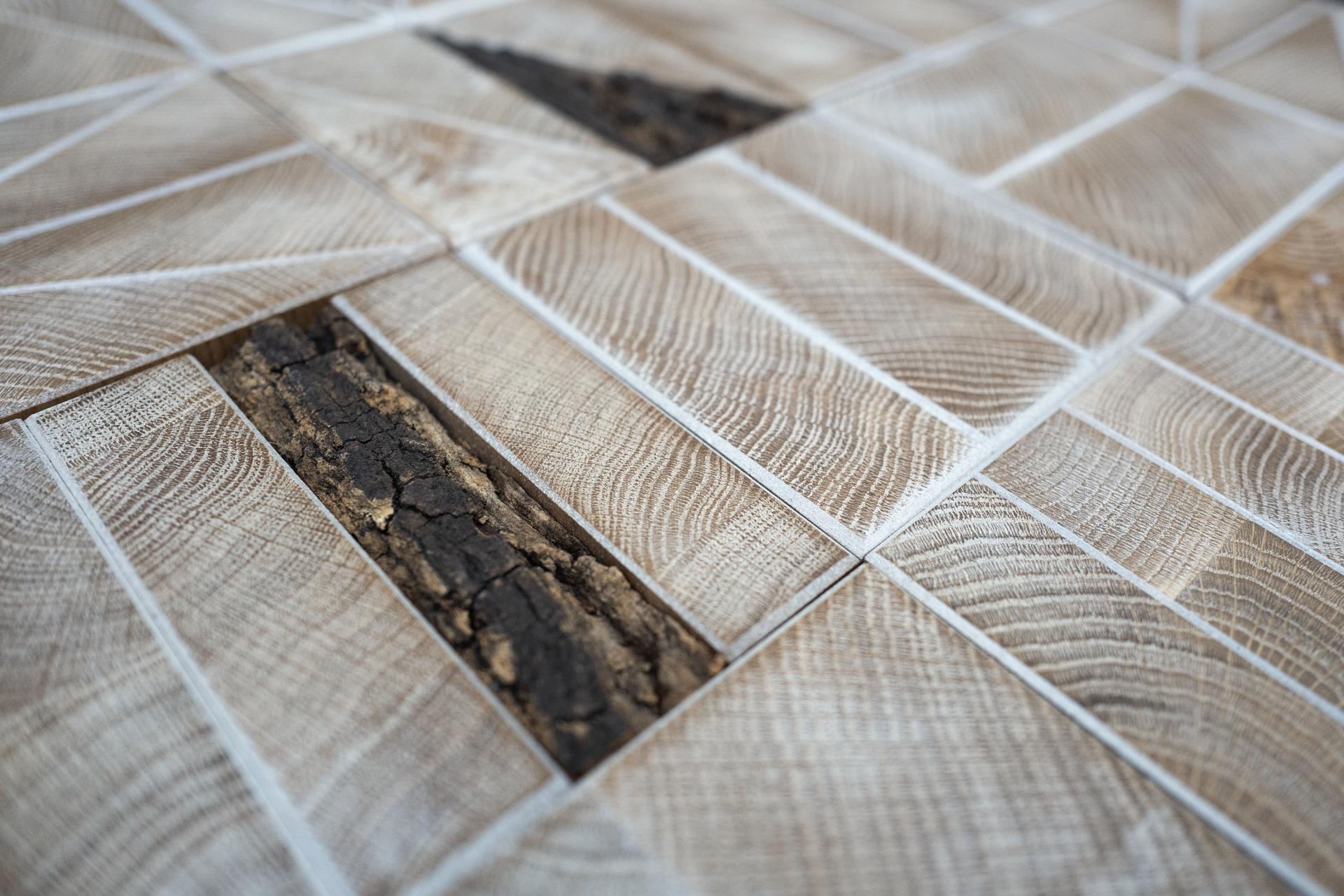 Close-up of sustainable wood tiles featuring unique textures, showcasing authentic craftsmanship by Innerspace Cheshire.