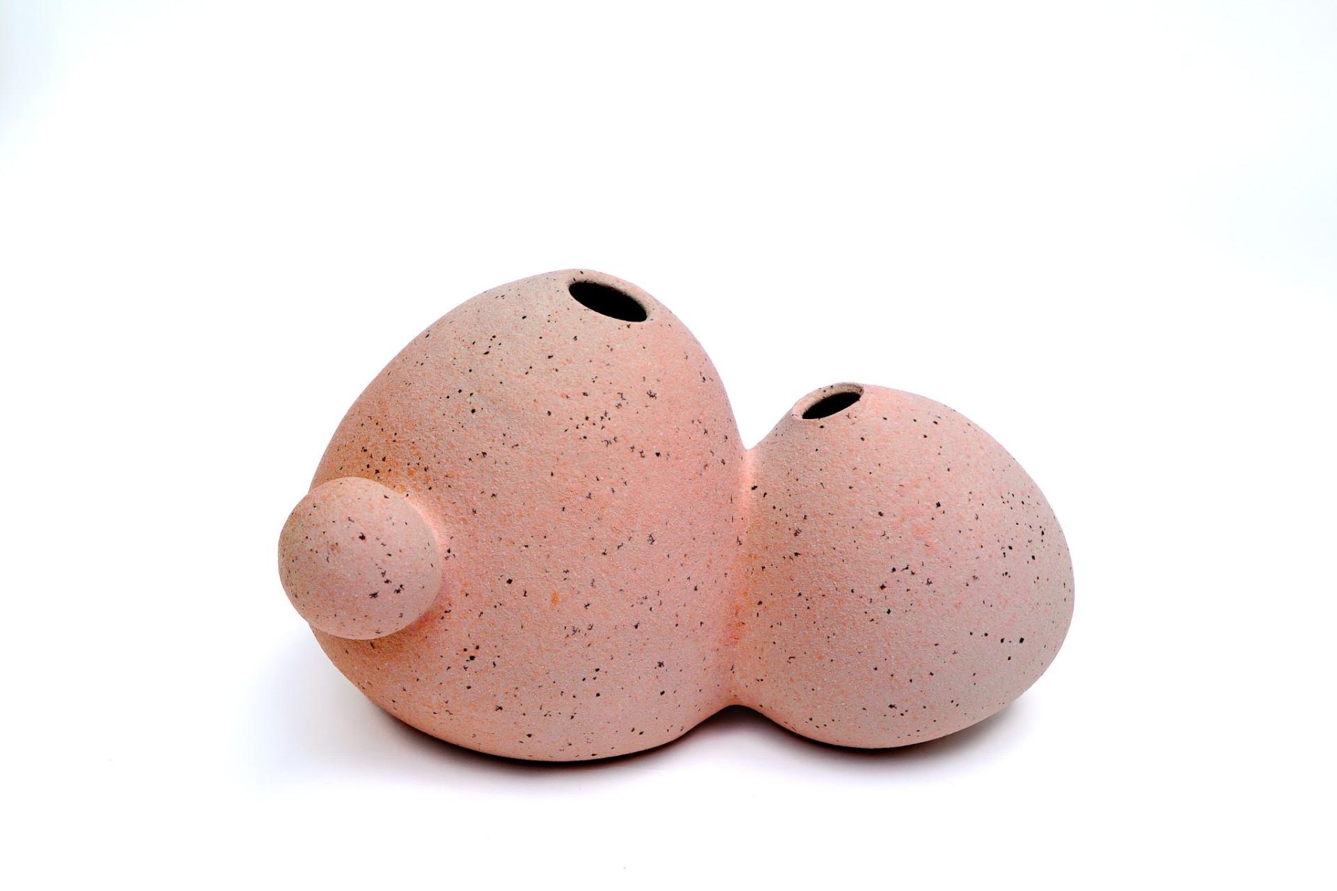 Unique pink ceramic sculpture by Bucharest-based artist Sandra Berghianu, showcasing functional and artistic elements.