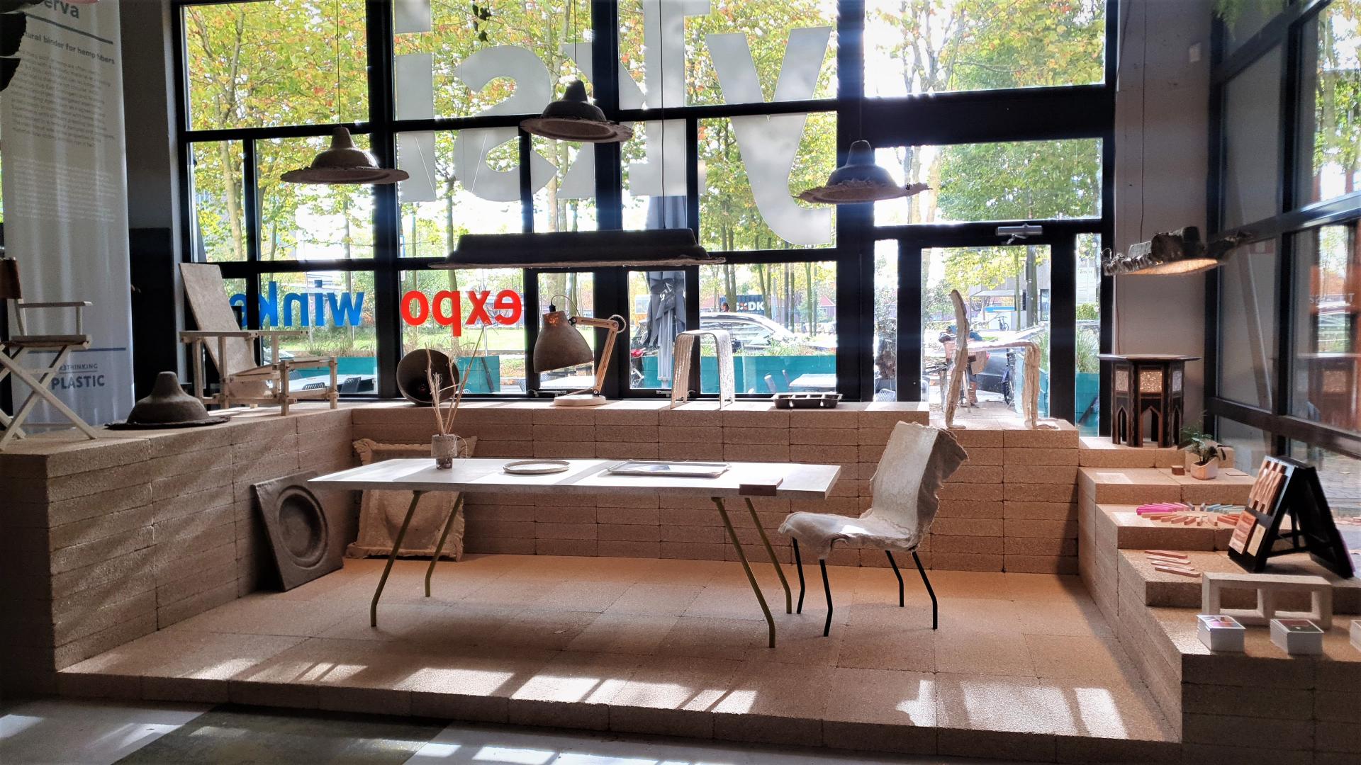 Innovative interior design display featuring sustainable materials, artwork, and furnishings at Dutch Design Week 2022.