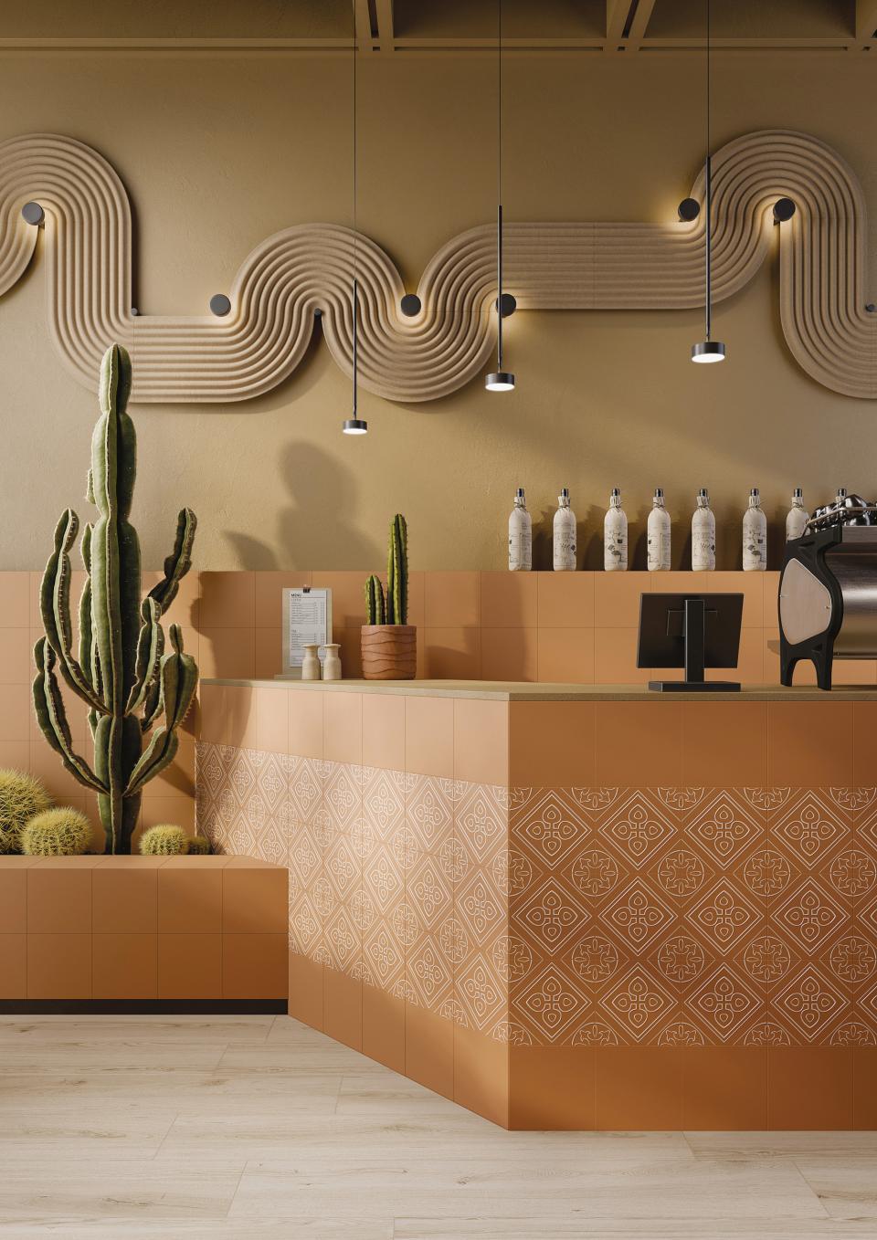 Modern café interior featuring Grestec's Silence Collection porcelain tiles, stylish plants, and elegant lighting.