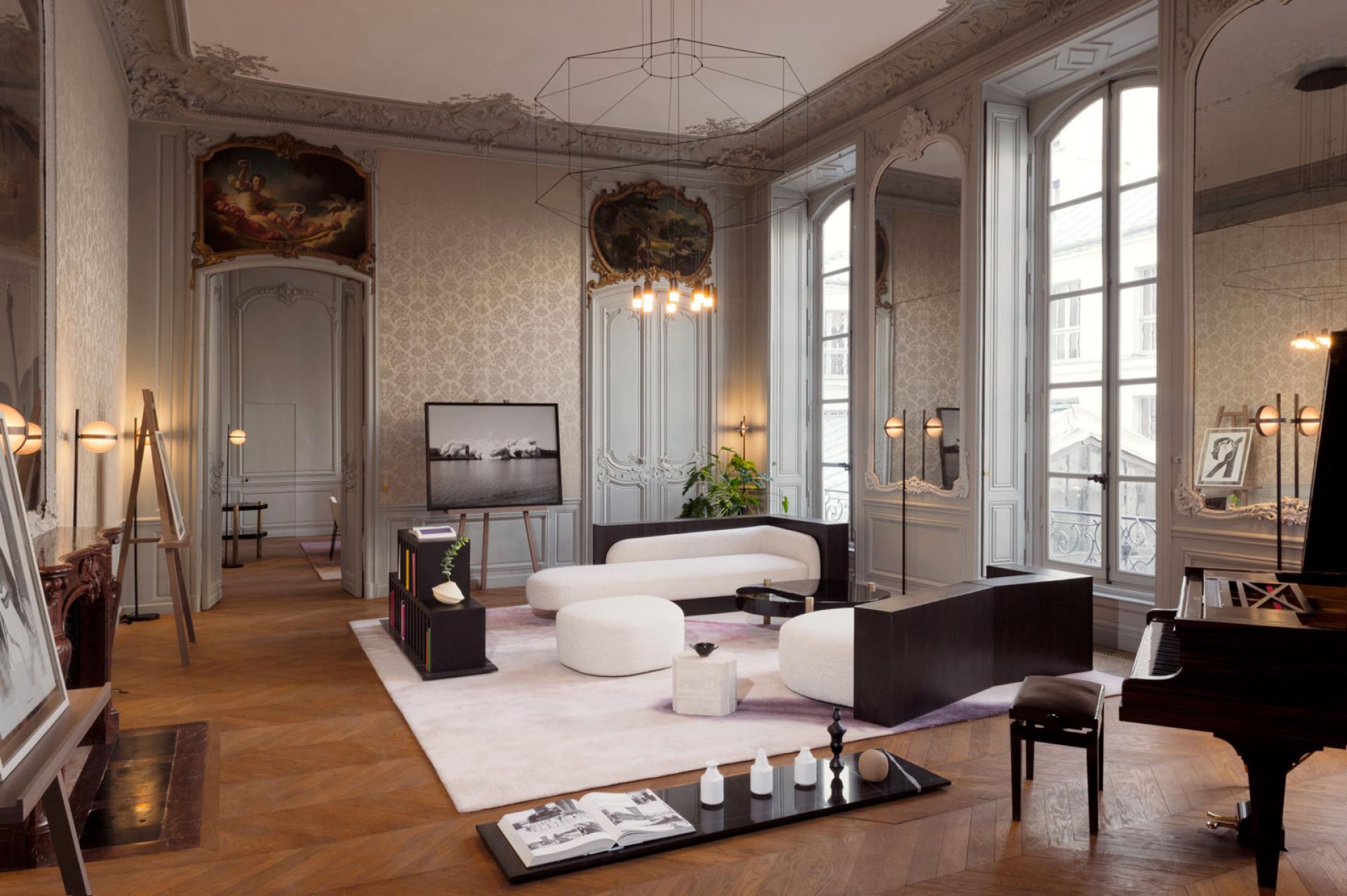 Stylish Parisian interior featuring modern furniture, elegant decor, and large windows, highlighting Paris's design influence during September.