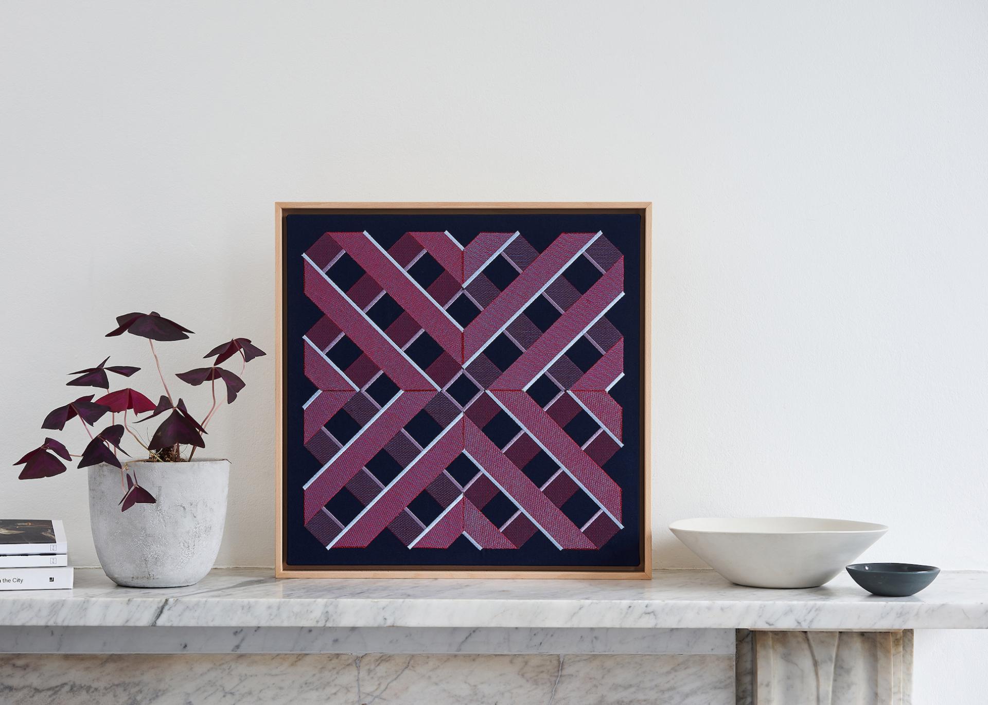 Digital embroidery artwork by DUO-HUE featuring a modern geometric design in rich burgundy and black tones.