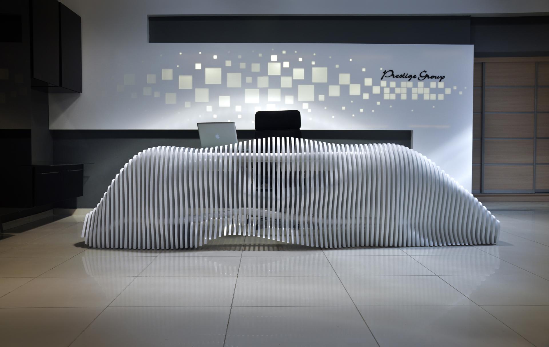 Modern reception desk design at Taner's Sons Design Studio, showcasing innovative architecture and interior aesthetics.