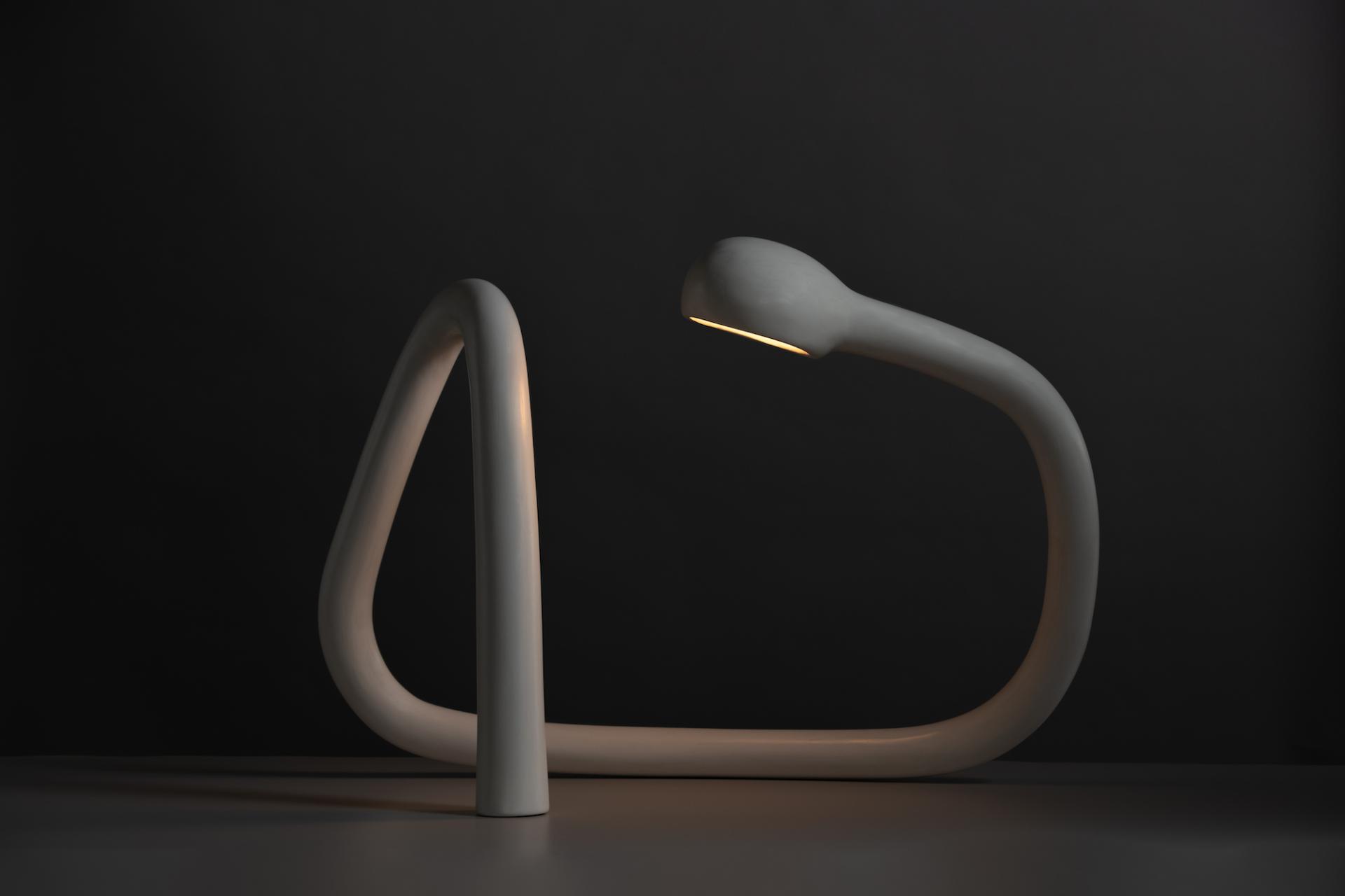 Sculptural modern lamp with a fluid, abstract design, featured in Reynold Rodriguez's solo show at Charles Burnand Gallery.