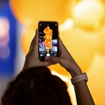 Capturing a vibrant display of the new Kuulas chandelier by Cameron Design House with glowing orange elements.