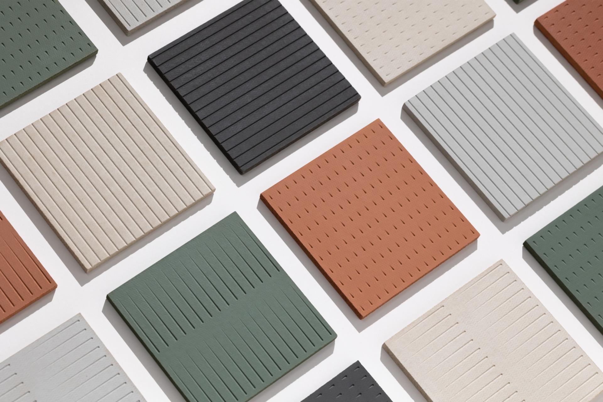 A variety of textured biomaterial samples in earthy colors, highlighting sustainable and low-carbon product options for 2025.