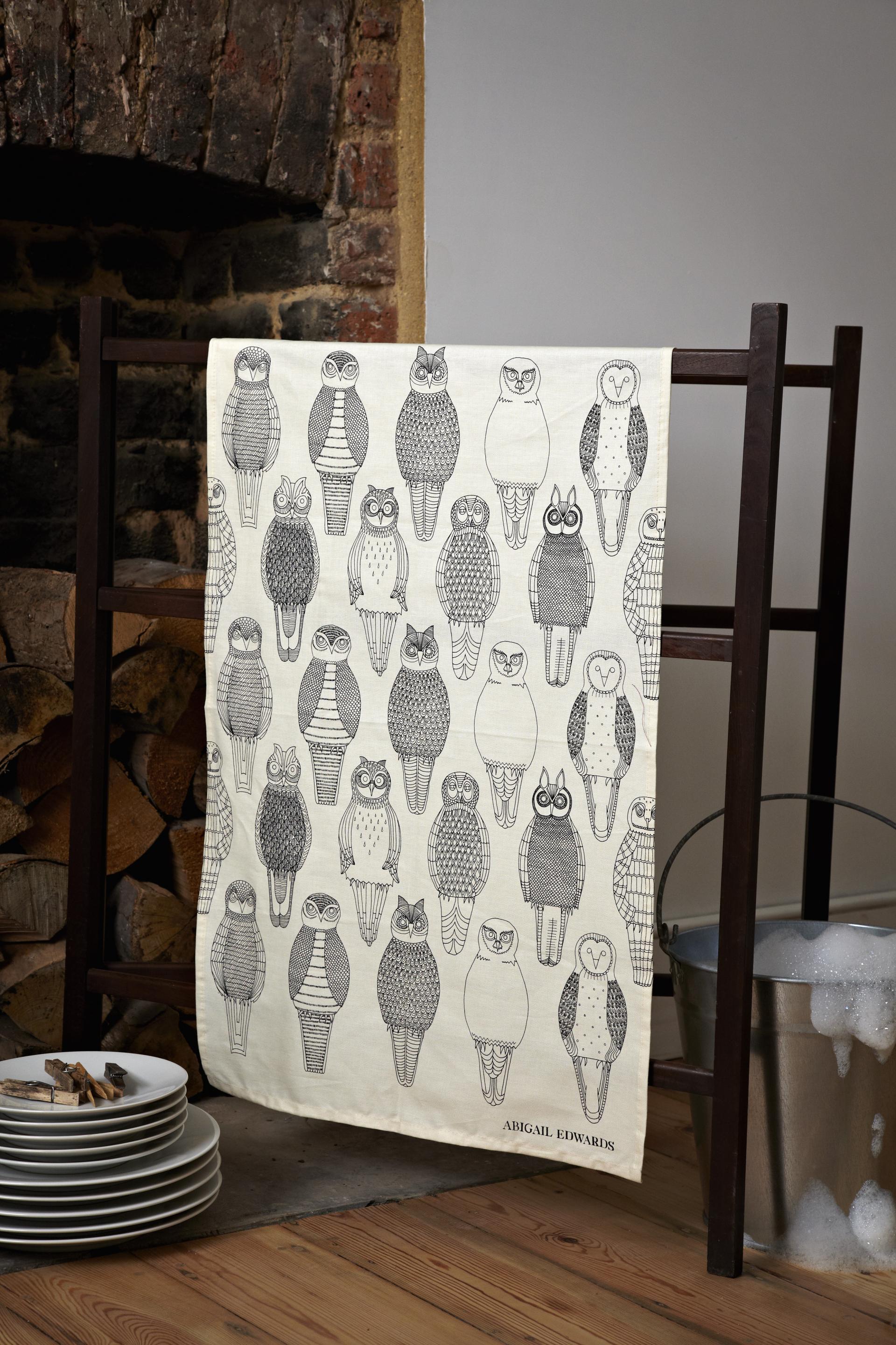 Patterned fabric featuring various whimsical owl designs by designer Abigail Edwards, highlighting nature-inspired art and home decor.