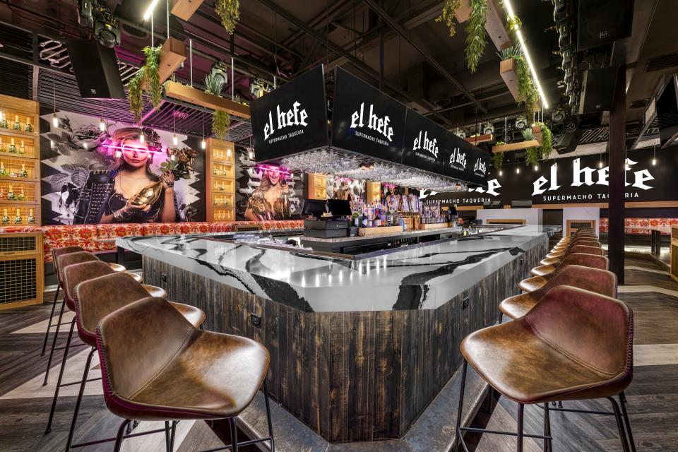 Modern bar interior of El Hefe Supermacho Taqueria featuring stylish seating and vibrant decor, perfect for Instagram.