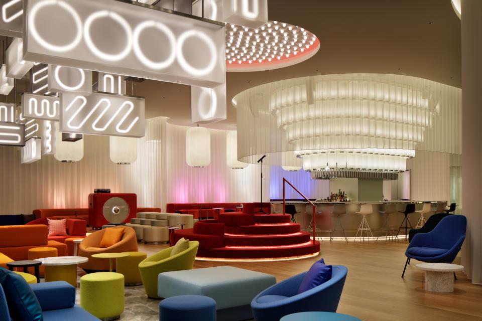 Stylish lounge area at W Osaka featuring vibrant seating, modern lighting, and a sleek bar design.