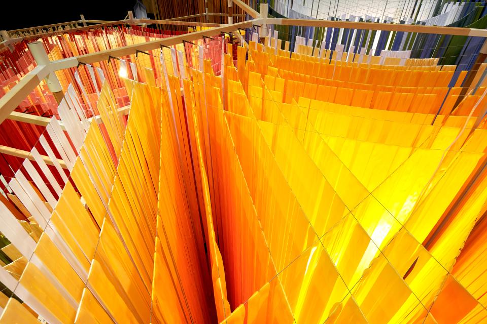 Vibrant installation featuring colorful translucent panels, highlighting the artistic intersection of food and design by Marije Vogelzang.