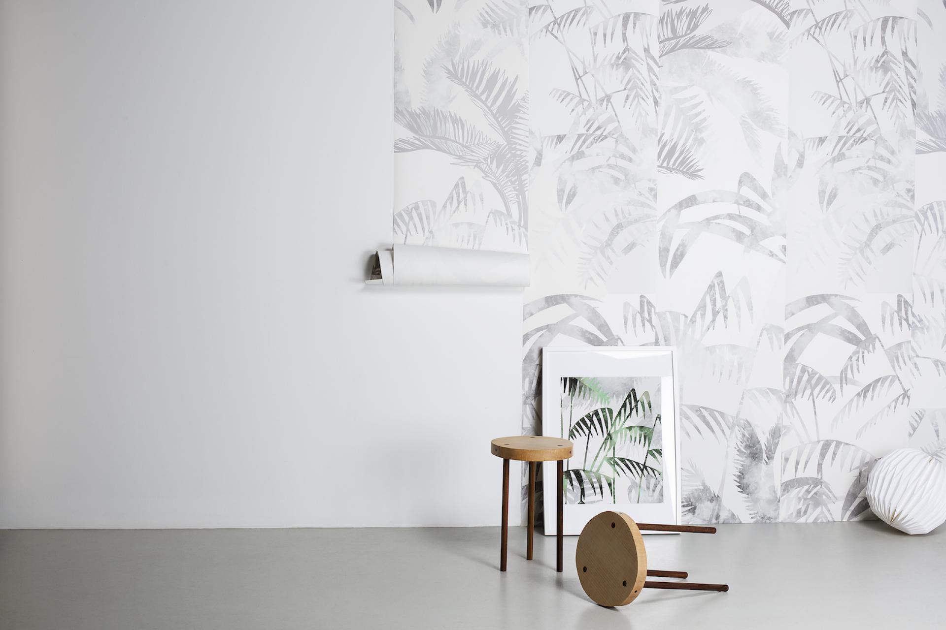 Stylish interior featuring Bespoke Atelier's unique wallpaper design with leafy patterns, complemented by minimalistic furniture.