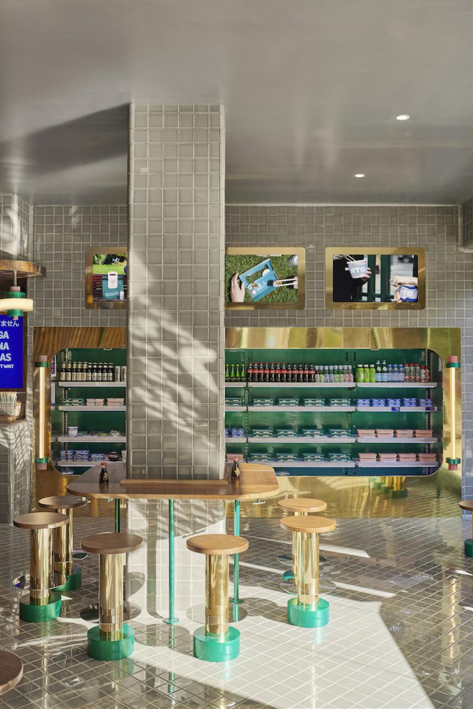 Modern sushi takeaway interior design featuring a vibrant color palette, sleek furniture, and organized product displays.