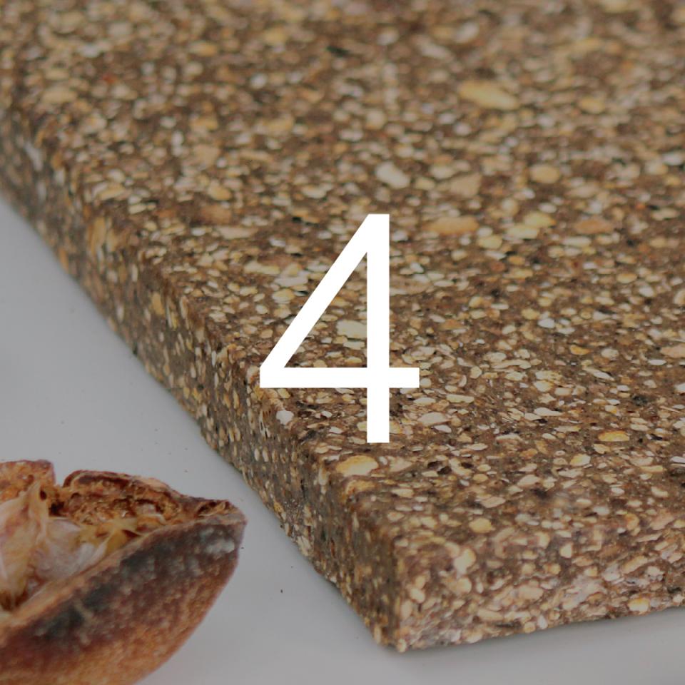 Textured material sample highlighting innovative design by Caracara Collective, with a natural element visible beside it.