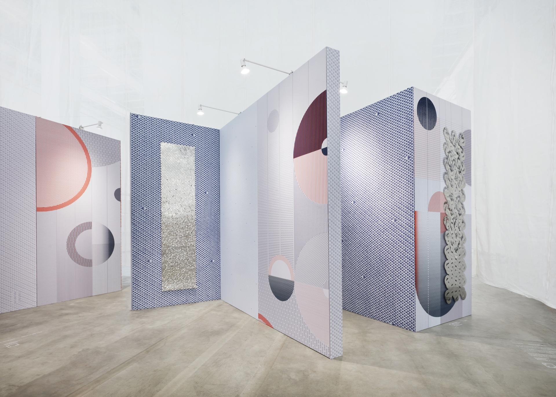 Innovative interior design showcasing textured wall panels in calming colors, reflecting sensory experience and restorative space concepts.