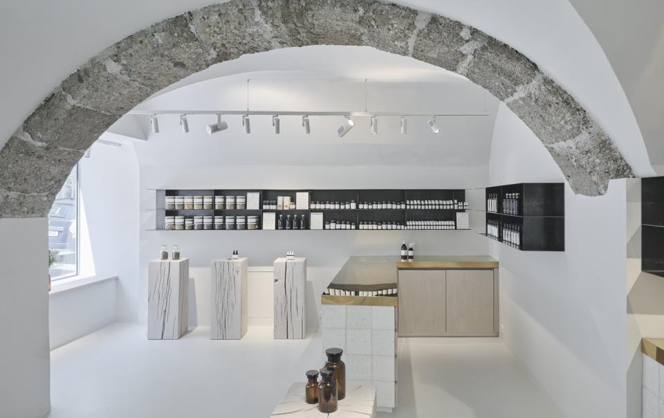 Modern Saint Charles store interior featuring natural cosmetics, minimalist design, and natural materials in Salzburg.