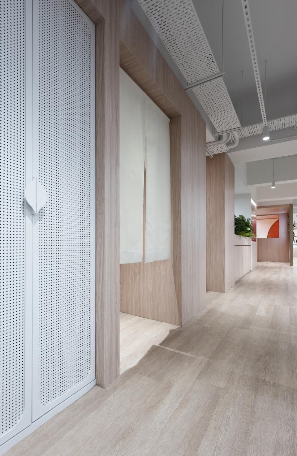 Modern office interior of Unicorn Stores HQ with wood paneling and a clean, minimalist design, emphasizing company heritage.