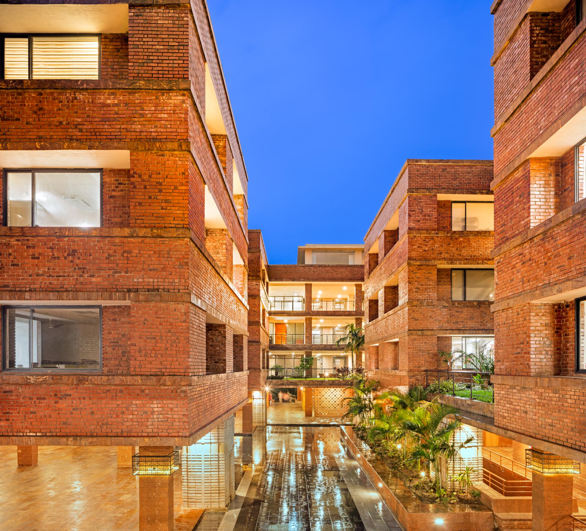 Krushi Bhawan by Studio Lotus features modern brick architecture with landscaped courtyards, awarded Supreme Winner at Surface Design Awards 2020.