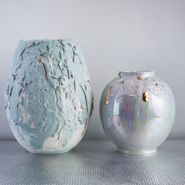 Coralla Maiuri's new Bottega d’Arte vases featuring iridescent finishes and volcanic textures, ideal for contemporary decor.