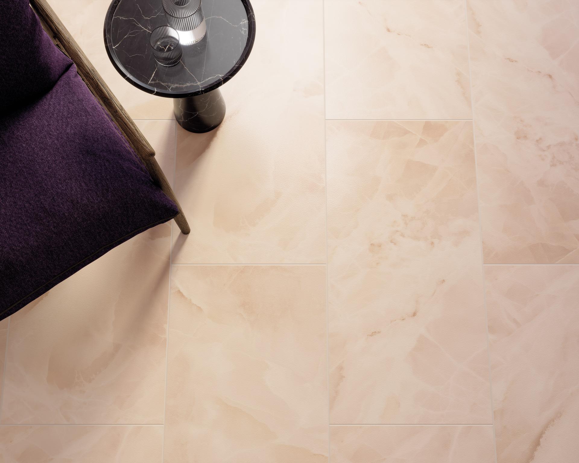 Stylish purple chair beside a modern black side table on elegant creamy marble flooring, highlighting sustainable interior design.