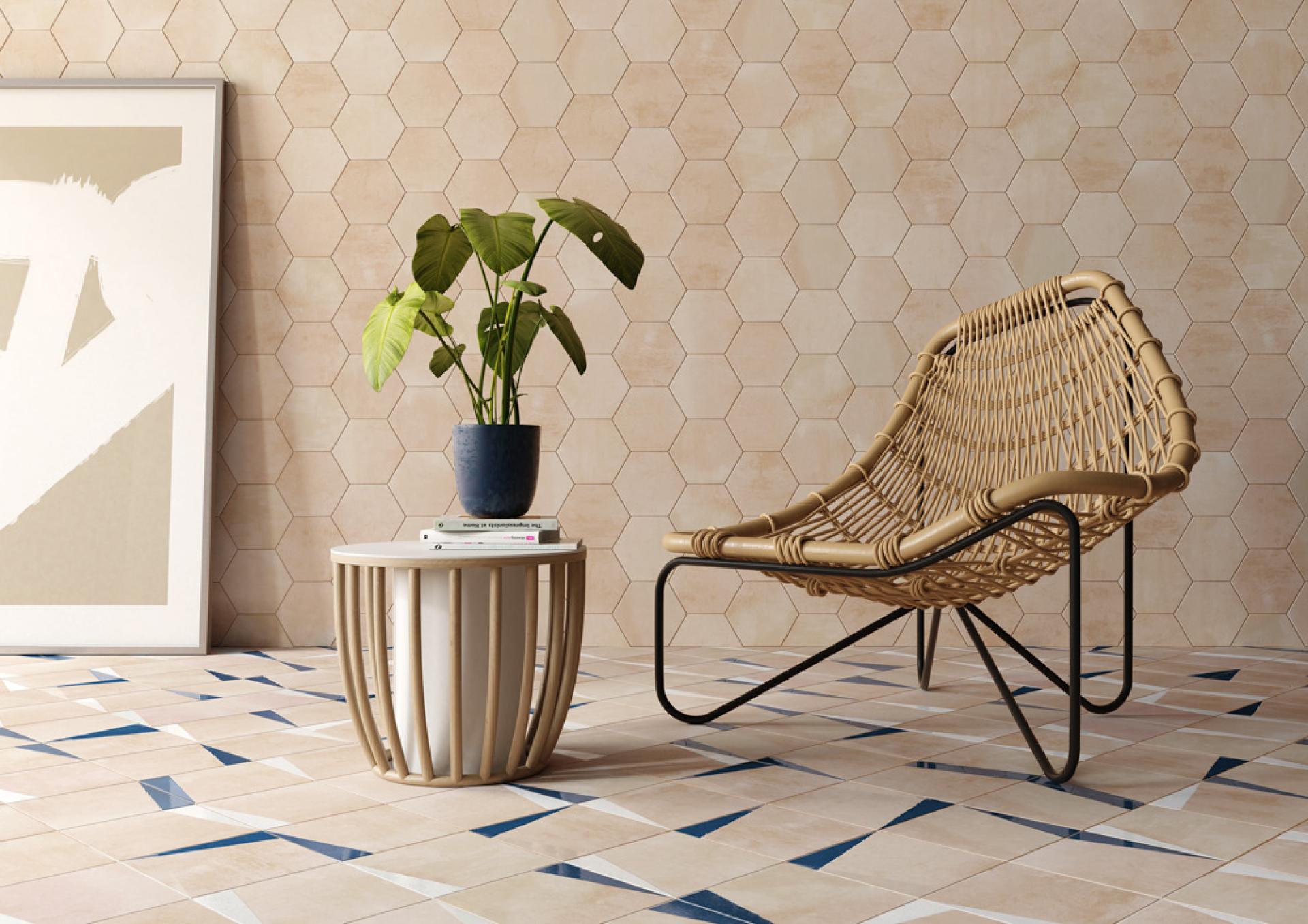Stylish interior featuring hexagonal tiles, a modern chair, and a plant, highlighting contemporary Spanish tile design trends.