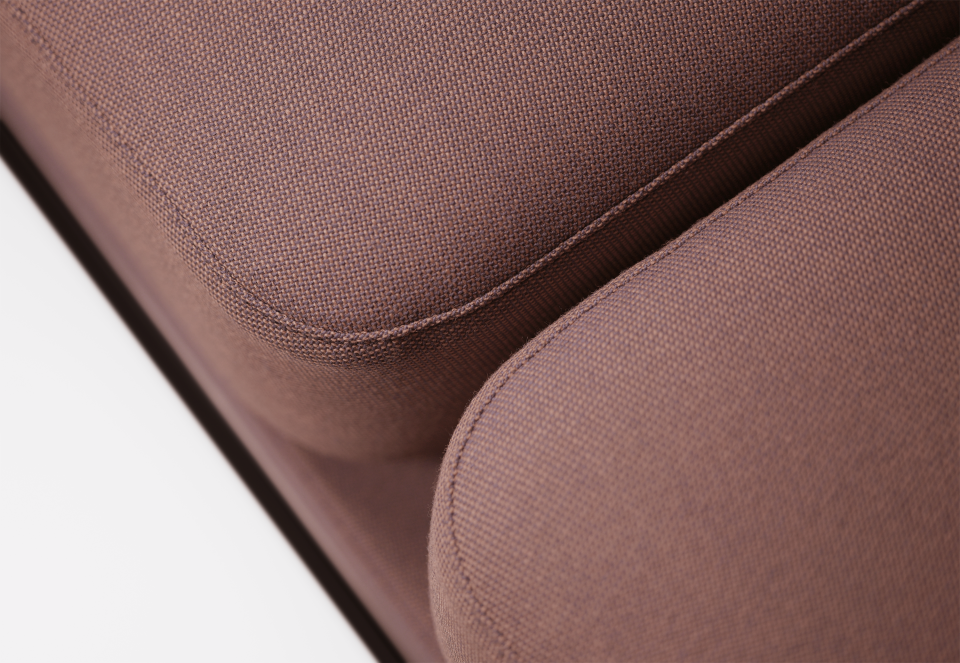Close-up of the Nudo Collection's minimalist sofa upholstery, highlighting its handcrafted design and textured fabric.