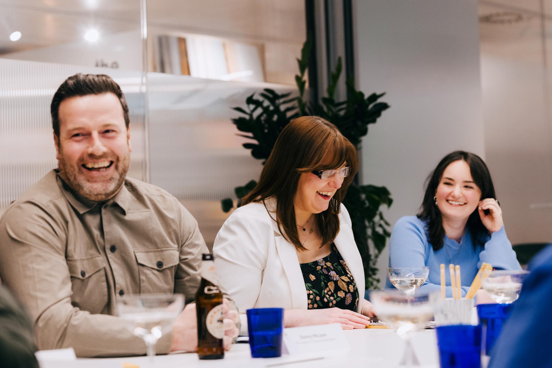 Participants engaged in a lively discussion on neurodiversity at Material Source Studio, highlighting the importance of flexibility.