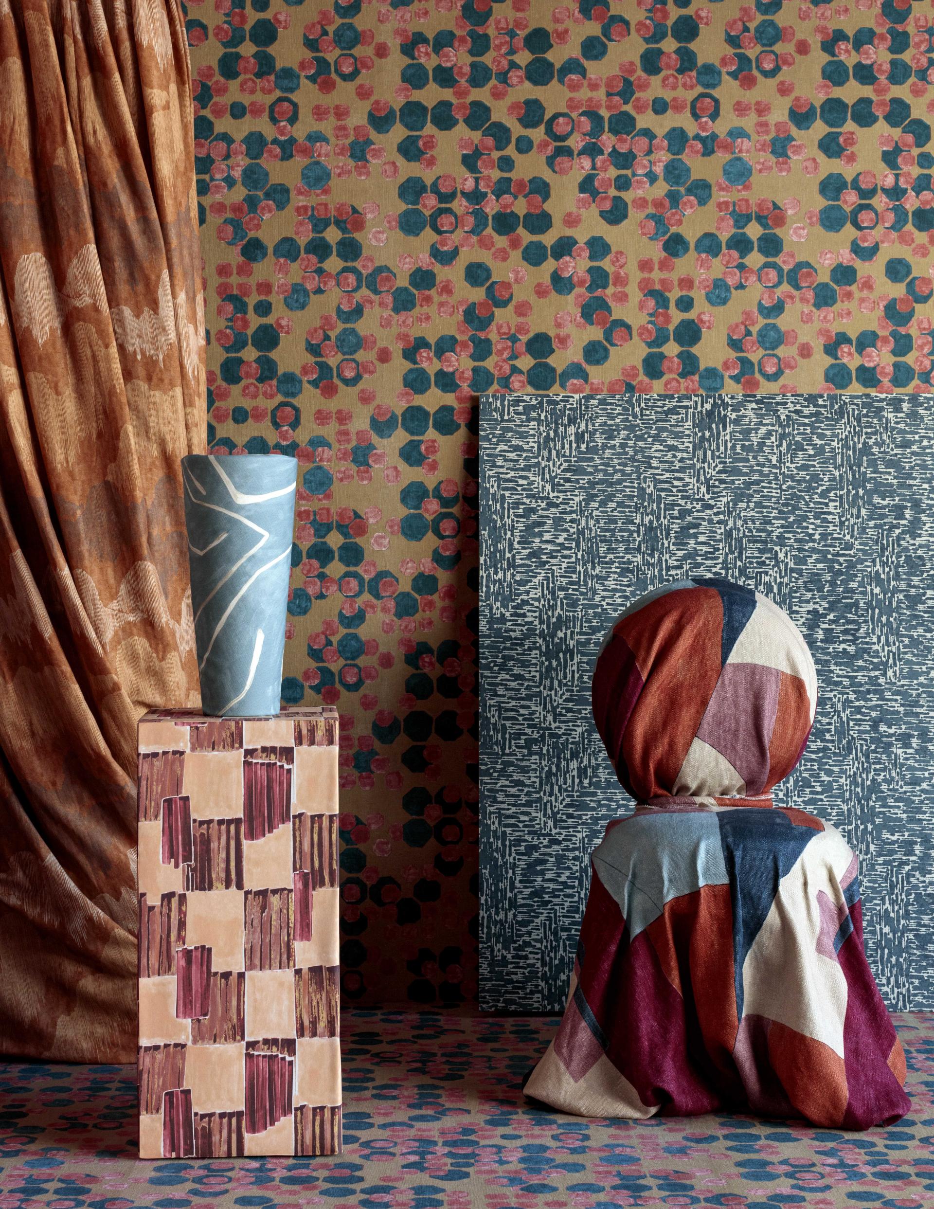 Textured fabrics and vibrant patterns showcase Lee Jofa's fifth collection by Kelly Wearstler, emphasizing contemporary interior design.