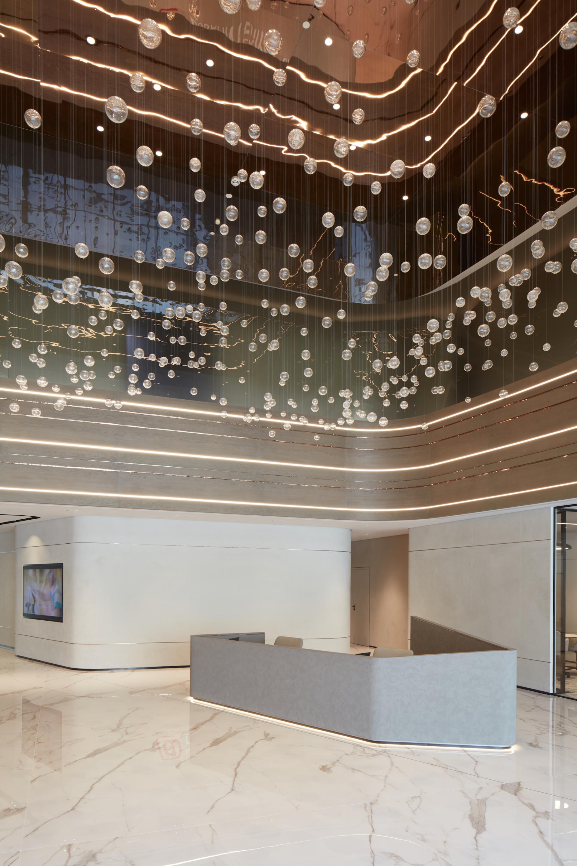 Modern multi-purpose management office space in Dubai Internet City featuring elegant lighting and sleek design elements.