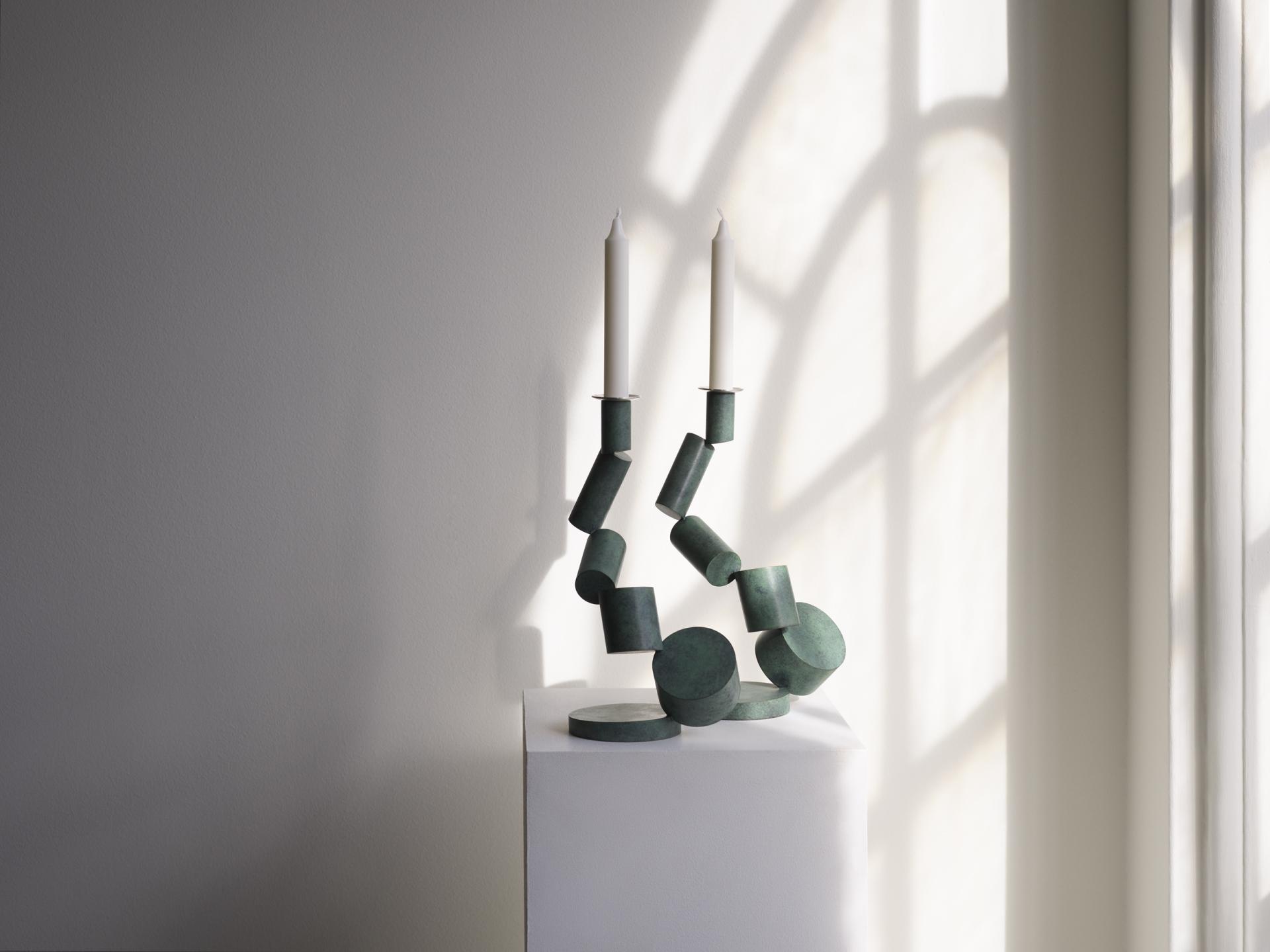 Sculptural candle holder made of green materials, featured at Collect 2023 in Somerset House, showcasing contemporary craft.
